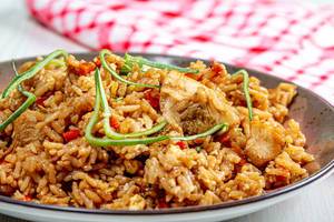Close up of chinese rice with chicken and vegetables
