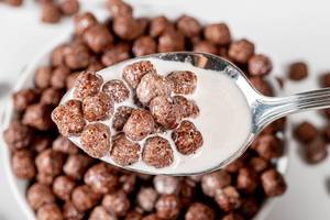 Close up of chocolate corn balls with milk (Flip 2019)