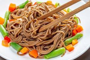 Close up of chopsticks and soba with vegetables (Flip 2019)