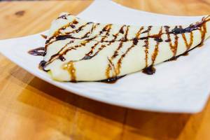 Close up of crepe with chocolate syrup (Flip 2019)