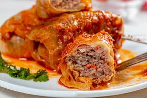 Close-up of cut stuffed cabbage with minced meat and rice inside (Flip 2019)
