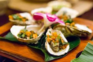 Close-Up of Grilled Oysters with Spring Onion Salsa