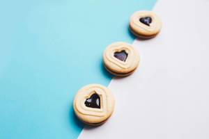 Close up of heart shaped biscuits on colorful background