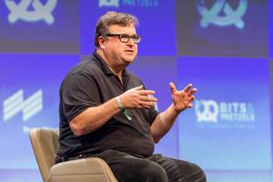 Close-up of investor and LinkedIn Co-Founder Reid Hoffman during a talk on stage at German founders conference Bits & Pretzels