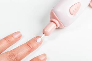 Close up of nail cuticle manicure treatment with electric machine