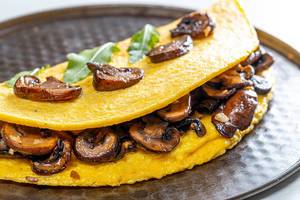 Close-up of omelet with mushrooms (Flip 2019)