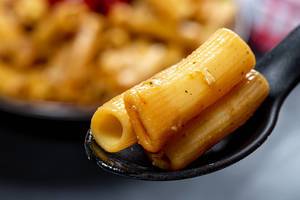 Close-up of pasta in black spoon (Flip 2019)