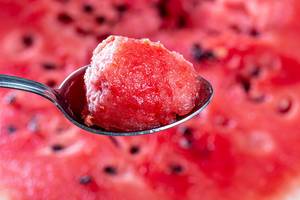Close-up of spoon with a piece of red watermelon