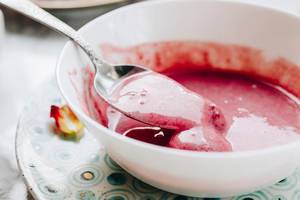 Close up of strawberry smoothie in a spoon. Healthy food
