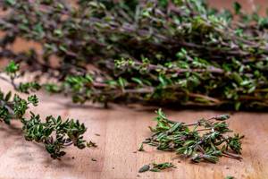 Close-up of thyme grass on wooden background