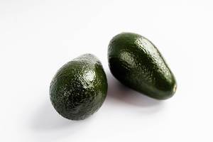 Close up of two avocados