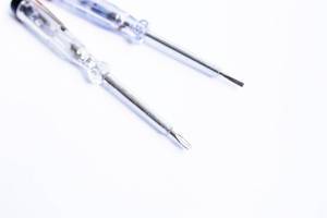 Close up of two mini screwdrivers on white background