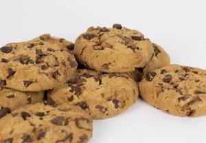 Close-up of typical American chocolate chip cookies on white background