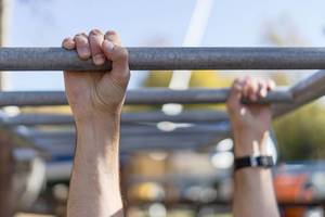 Close Up on the Hands While Workout on the Horizontal Ladder