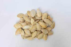 Close Up on the Roasted Pumpkin Seeds in Shell