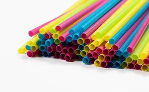 Close Up Photo of colorful Plastic Straws on white Background