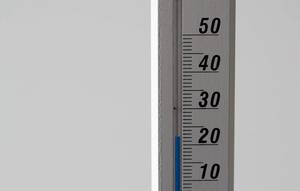 Close Up Photo of Thermometer showing 23 degrees Room Temperature on White Background