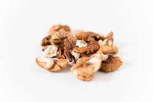 Close Up Photo of Walnuts on White Background