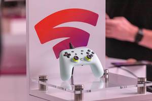 Close Up Photo of White Google Stadia Controller on display at the Gamescom Gaming Fair in Cologne, Germany