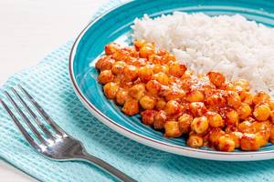 Closeup chickpeas in tomato sauce with rice