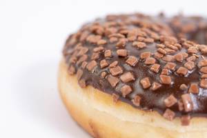 Closeup Macro of Chocolate Donut on the white background