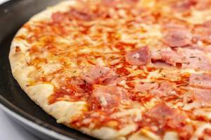 Closeup of Baked Pizza with Ham