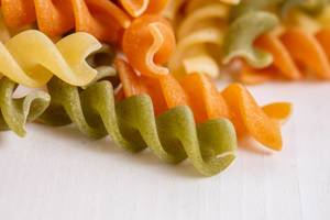 Closeup of Colored Pasta on the white background