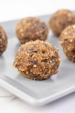 Closeup of Energy Balls with Walnuts Palm Dates and Sesame