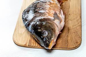 Closeup of fresh raw carp on kitchen Board (Flip 2019)