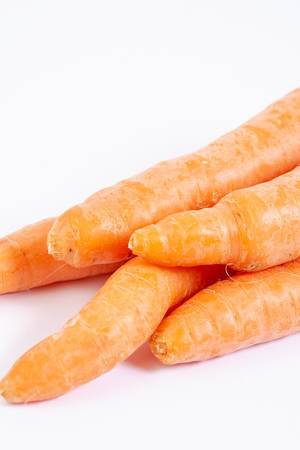 Closeup of Fresh Raw Carrots on the white background