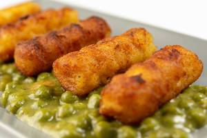 Closeup of Potato Croquettes with Cooked Green Peas (Flip 2019)