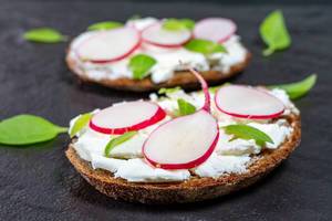 Closeup of sandwiches with cheese, slices of radishes and Basil (Flip 2019)