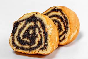 Closeup of slices of biscuit roll with poppy seed filling