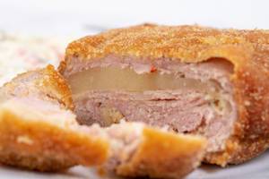 Closeup of Stuffed and breaded Pork Meat with Cheese