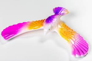 Closeup toy multi-colored eagle with spread wings (Flip 2020)
