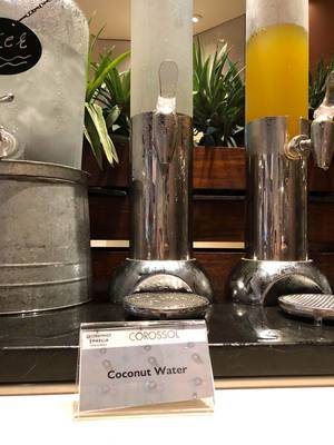 Coconut Water dispenser at hotel buffet of Constance Ephelia Resort in Mahé, Seychelles