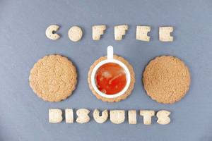 Coffee and biscuits words written with biscuit shaped letters