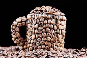 Coffee beans in a cup, black background (Flip 2019)