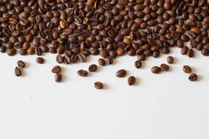 Coffee beans on white table