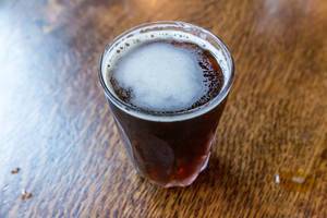 Coffee top trends: close-up of Nitro cold brew in a glass