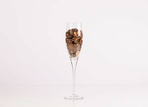 Coins in champagne glass