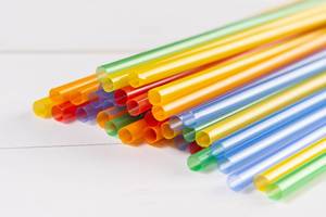 Colored Plastic Straws for juice on the table