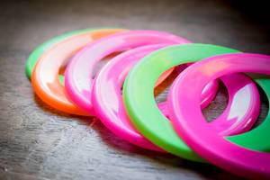 Colorful frisbees on wood