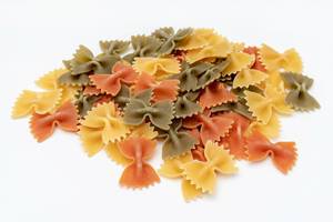 Colorful Pasta in Bow shape above white background (Flip 2019)