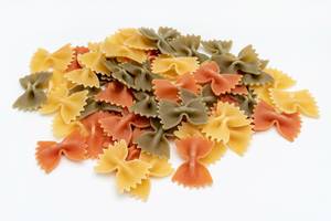 Colorful Pasta in Bow shape above white background