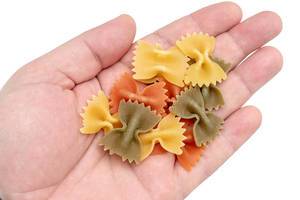 Colorful Pasta in Bow shape on the hand