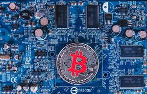 Computer mother board with silver Bitcoin