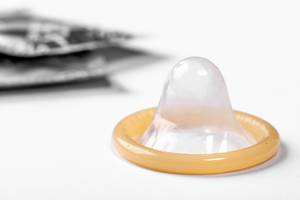 Concept of protection and safety of sex - condom on white background (Flip 2019)