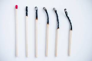 Concept shot of fire matches and burned matches