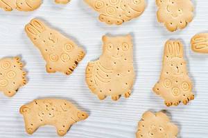 Cookies in the shape of animals on a white background. Top view (Flip 2019)
